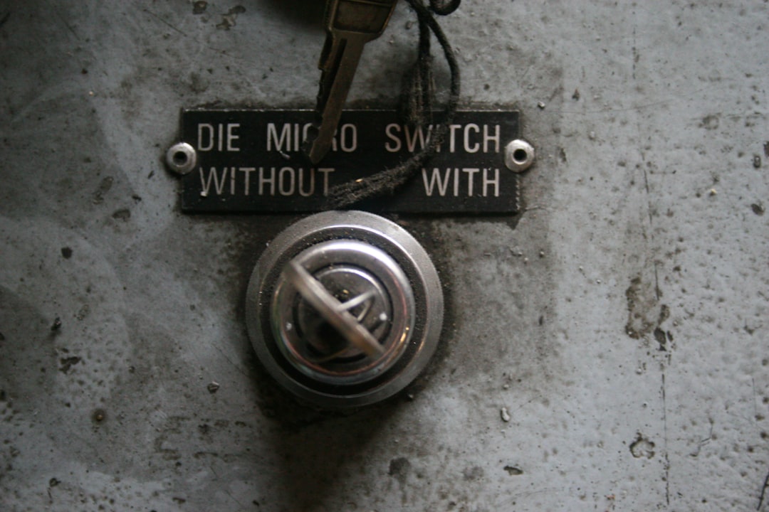 data ownership — Close-up of a vintage electrical switch with label.