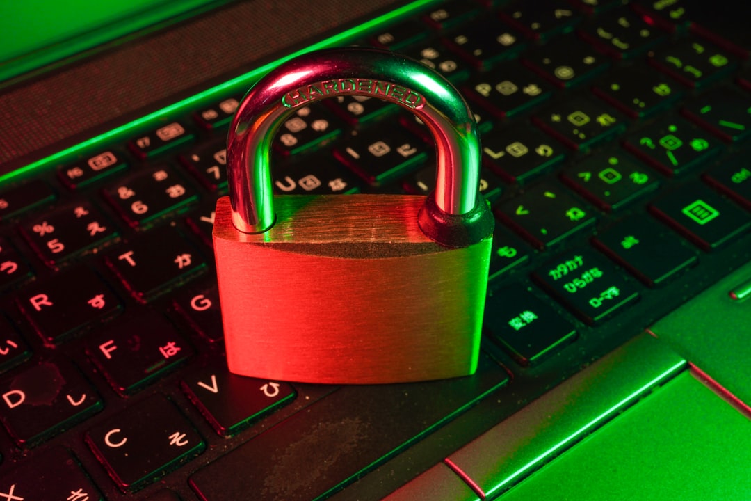 origination moment — red padlock on black computer keyboard