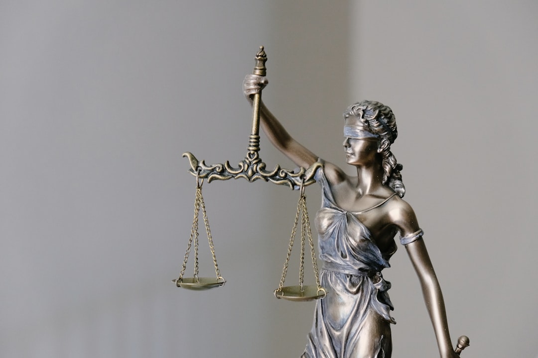 data licensing — lady justice statue with scales and sword