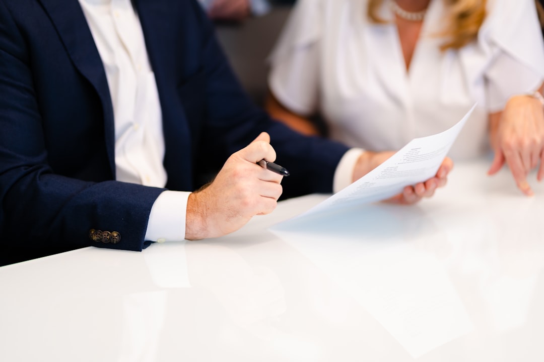 IP frameworks data ownership — a man and a woman sitting at a white table